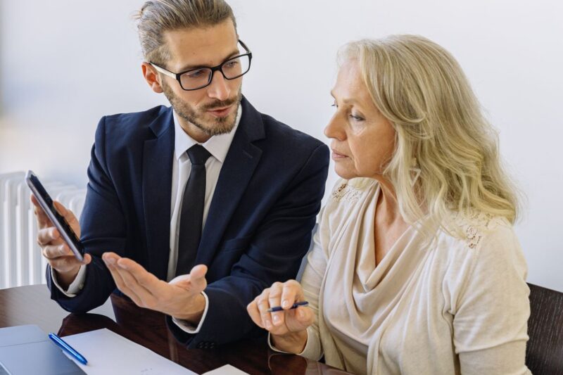 Executive benefits resource center - advisor reviewing plan design forms with a business owner