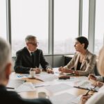 Business executives in a strategic meeting in a modern office, representing leadership a company wants to reward and retain