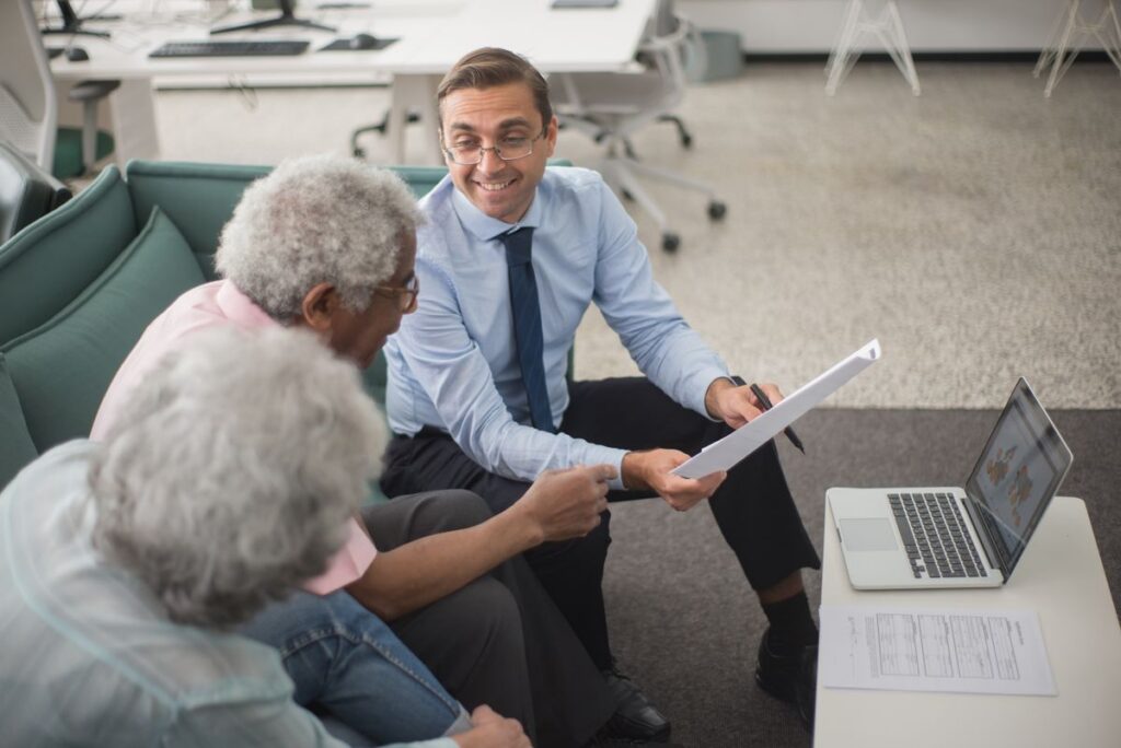 Advisor comparing long term care insurance product options with a client