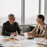 Business owner reviewing a five-year exit planning checklist with advisors