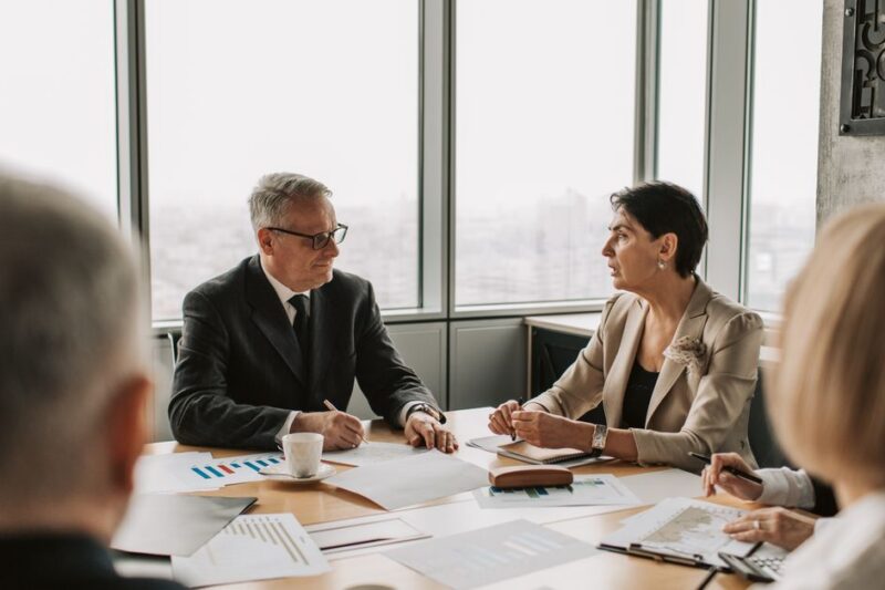 Business owner reviewing a five-year exit planning checklist with advisors