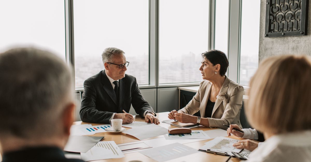 Business owner reviewing a five-year exit planning checklist with advisors