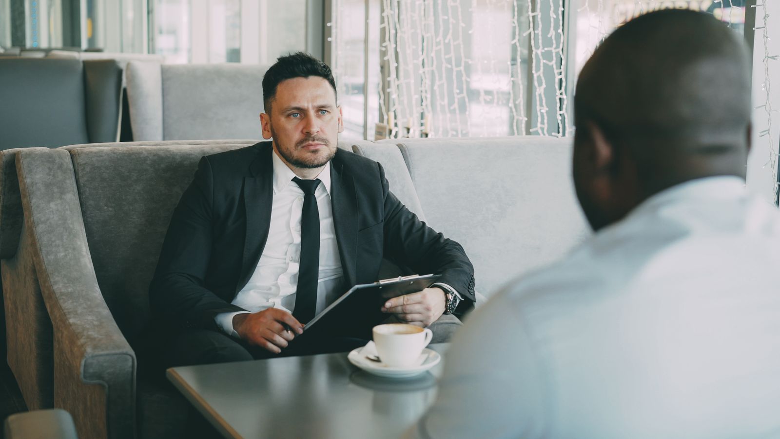 Business owner discussing a key employee retention plan with an executive benefits consultant
