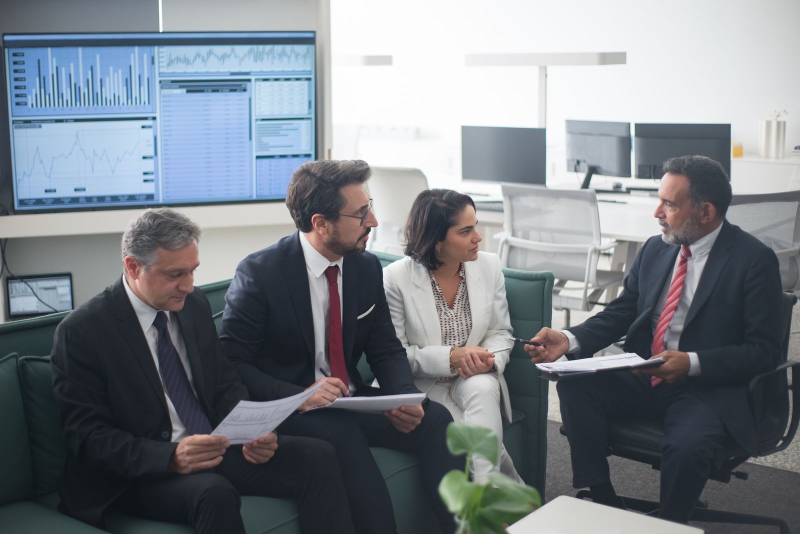 Attorney, CPA, and financial advisor reviewing a phantom stock plan design together